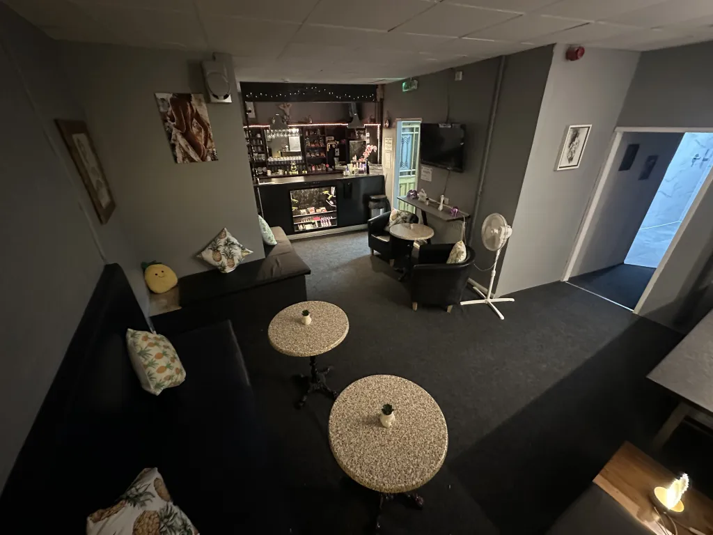 Social lounge and bar seating area at The Naughty Pineapple